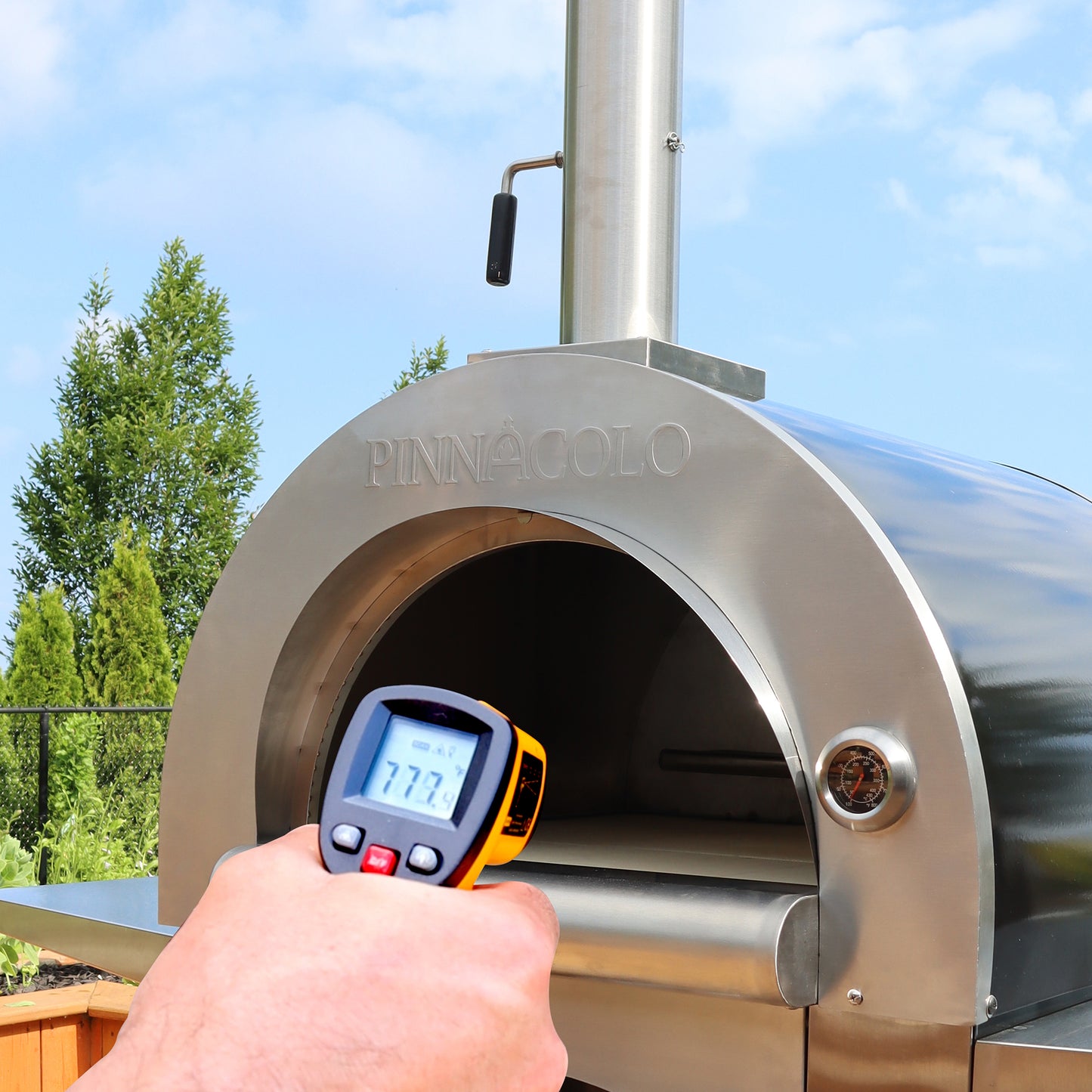 PINNACOLO | IBRIDO (HYBRID) Gas/Wood Pizza Oven With Accessories - PPO103 with temperature being checked 